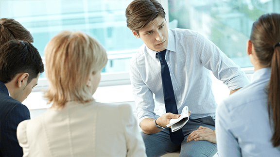 Newspaper salesperson meeting with clients